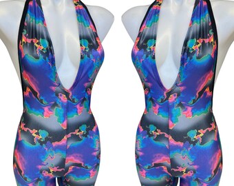 May include: A black halter-style bodysuit with a deep V-neckline and a colorful abstract print. The print features shades of blue, purple, pink, and green.