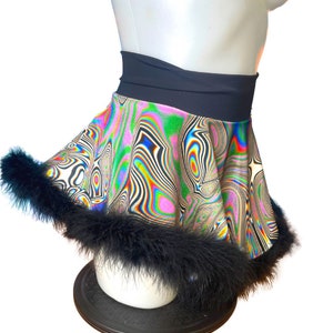 May include: A colorful, psychedelic print mini skirt with a black waistband and a black feather trim.