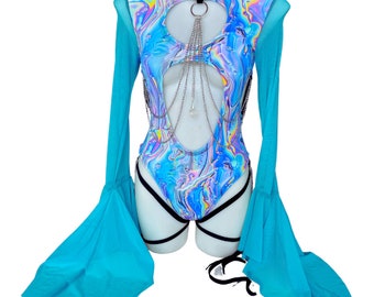 May include: A blue and white bodysuit with a swirling, iridescent pattern. The garment features a keyhole cutout, silver chain detailing, and sheer blue bell sleeves. Black straps are attached to the bottom of the bodysuit.