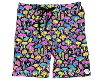 May include: Black athletic shorts with a colorful mushroom and leaf pattern. The shorts have a drawstring waistband and a small "LYTE CULTURE" logo on the bottom right.