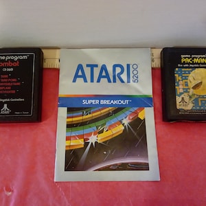 Vintage Gaming Consoles Games, Atari Pac-Man and Combat Games with a Super Breakout Game Book, 1980&#39;s~