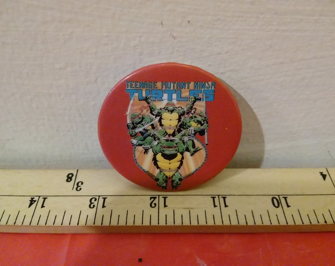 Vintage Pushback Pin, Teenage Mutant Ninja Turtles, Turtles Jumping Out with Red Background, 1990's