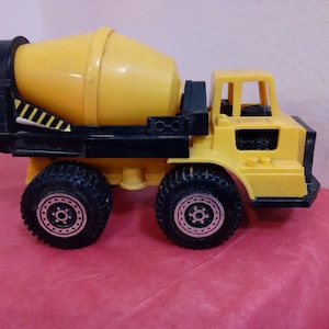 Vintage Plastic Toy Vehicles, Plastic Tootsie Toys, Cement Mixer, Dump truck, Grader, 4-Wheel Truck, and a Ladd Dump Truck