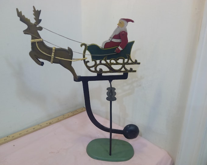 Vintage Metal Swinging Christmas Decor, Santa in Sleigh with Reindeer moving Christmas Decor that Seesaws and Arms and Head of Reindeer Move