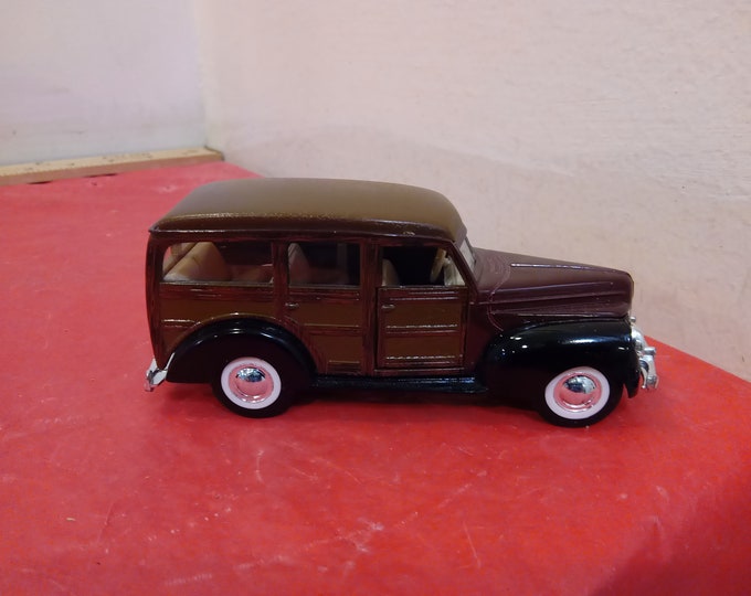 Vintage Tin/Plastic Vehicles, Woody Wagon, Plastic Aurora Race Car, Tin Airplane, Tin Friction Police Car, and Tin Friction Fire Car