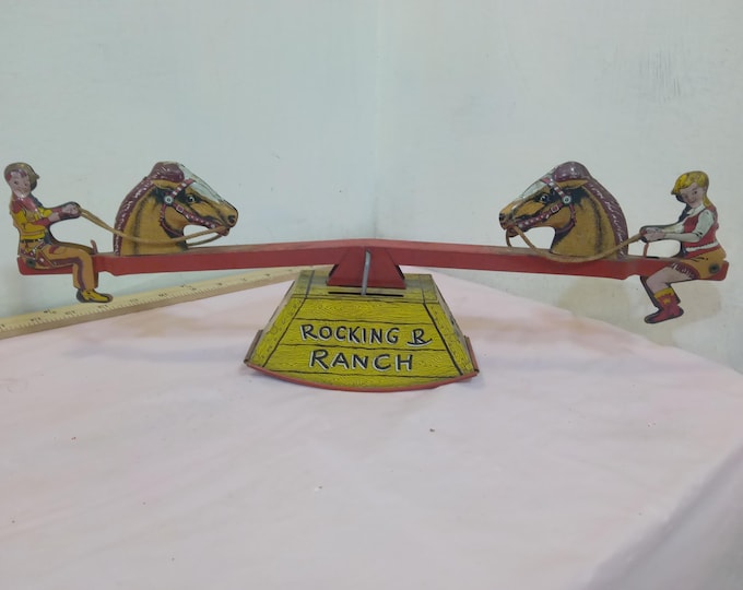 Vintage Tin Wind-Up Toy, A Walt Reach Toys made by Courtland "Rocking R Ranch" Seesaw with Cowboy and Cowgirl, 1950's
