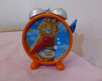 Vintage Plastic Toy Figurines, Garfield Answer Clock, Dalmatian X-mas Lite, Pluto Push Figure, Lost in Space Pinball Game, and Other Toys