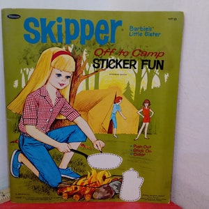 May include: A vintage Skipper sticker book featuring a blonde doll with a red headband, camping in a green forest. The book cover has the text "Skipper Barbie's Little Sister Off to Camp STICKER FUN".