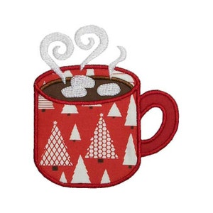 May include: Embroidered red mug with white Christmas trees, filled with hot chocolate and marshmallows. White steam curls up from the top. The mug has a red handle and a brown rim.
