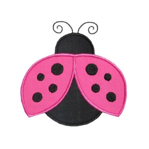 May include: An embroidered ladybug design in pink and black. The ladybug features pink wings with black spots, a black body, and curly antennae. The design is set against a white background.