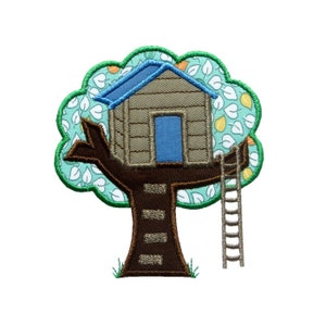 May include: Embroidered patch of a treehouse with a brown roof, blue door, and a ladder. The tree is green with white and yellow leaves.