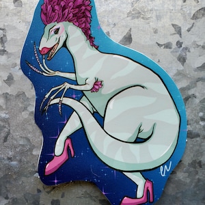 May include: A die-cut sticker featuring a pale blue dinosaur with a vibrant magenta mohawk, long manicured fingernails, and bright pink high-heeled shoes. The dinosaur is set against a dark blue background with small pink and white star accents.