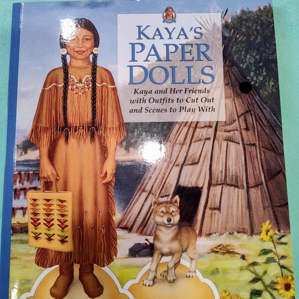 Paper doll book featuring Kaya, an American Girl doll