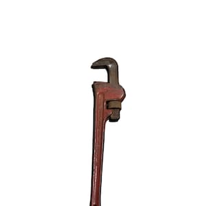 May include: A red pipe wrench with a black handle and a silver adjustable jaw.