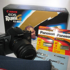 Like New Canon EOS Rebel G 35 mm SLR Film Camera With  35~80 mm Canon Lens in Original Retail Box with Batteries Strap and Lens Cap