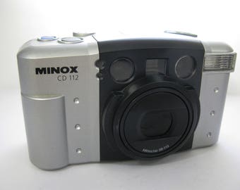 Mint Minox CD 112 35 mm Camera with Minoctar 38-112 mm Zoom Lens Databack, with Manual, Original Paperwork and Retail Box