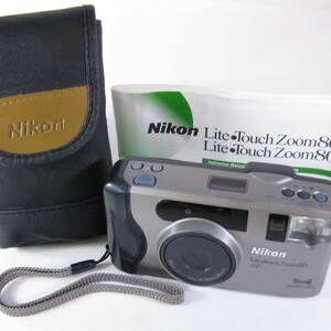 Vintage Nikon Lite Touch Zoom 80 AF 35 mm Film Camera with 38-80mm Panorama QD w/ Strap Case Manual