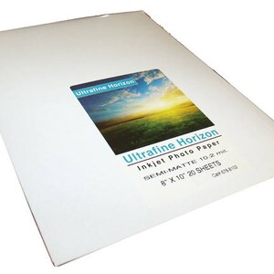 May include: A stack of white semi-matte inkjet photo paper sheets. The product label reads "Ultrafine Horizon Inkjet Photo Paper" and includes the dimensions 8" x 10" and the quantity of 20 sheets.
