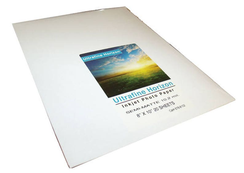 May include: A stack of white semi-matte inkjet photo paper sheets. The product label reads "Ultrafine Horizon Inkjet Photo Paper" and includes the dimensions 8" x 10" and the quantity of 20 sheets.