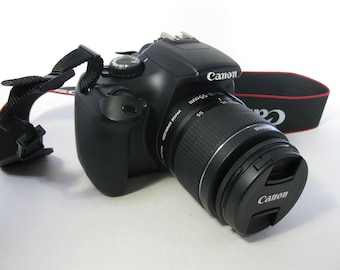 DSLR Canon EOS Rebel T-3 (1100D) Digital Camera with Canon E F S 18-55 mm IS with Canon Charger, Canon Battery, and Strap