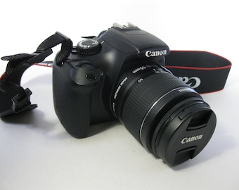 DSLR Canon EOS Rebel T-3 (1100D) Digital Camera with Canon E F S 18-55 mm IS with Canon Charger, Canon Battery, and Strap