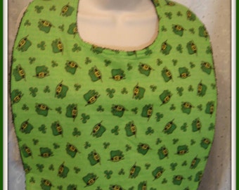 St Patrick's Day Leprechaun bowlers and shamrocks dance across a kelly green field on this adorable print.
