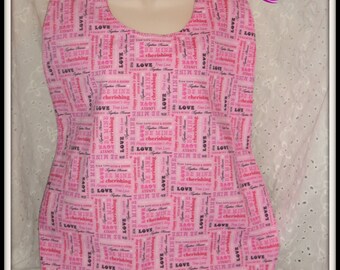 Valentine expressions on a bright pink background adorn this full lap bib for adults/teens