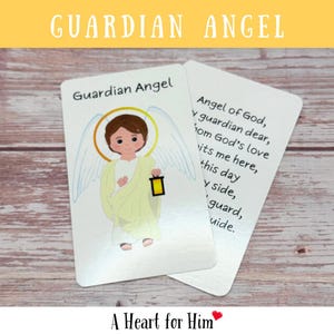 May include: Two white rectangular prayer cards featuring a cartoon illustration of a brown-haired angel with a yellow halo, white wings, and a yellow robe holding a lantern. The text reads Guardian Angel and the Angel of God prayer in black.