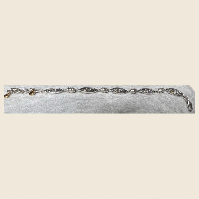 Conjunto de pulsera y pendientes con forma de corazón dorado en tono plateado de Brighton imagen 7