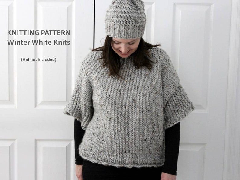 May include: Knitting pattern for a grey speckled sweater with a wide, slightly flared sleeve. The sweater is shown on a model wearing a grey beanie. The text "Knitting Pattern Winter White Knits (Hat not included)" is displayed above the model.