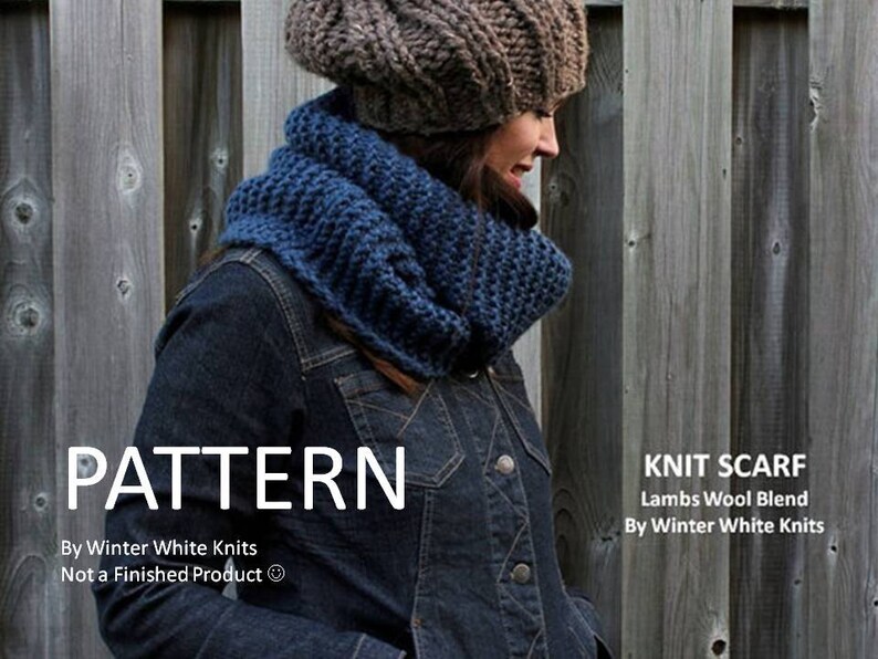 May include: A chunky blue knit scarf and a brown knit beanie. The image includes the text: PATTERN By Winter White Knits Not a Finished Product, and KNIT SCARF Lambs Wool Blend By Winter White Knits. The items are worn over a dark denim jacket.