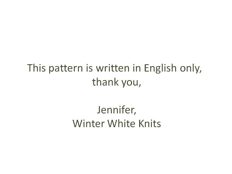 May include: A white rectangular sign with black text that reads: This pattern is written in English only, thank you, Jennifer, Winter White Knits. The text is centered and presented in a simple, clear, sans-serif font style.