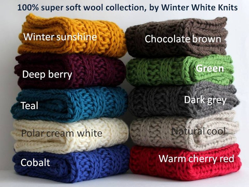 May include: A stack of ten 100% super soft wool knit scarves in various colors, including winter sunshine, chocolate brown, green, deep berry, teal, polar cream white, cobalt, dark grey, natural cool, and warm cherry red. 100% super soft wool collection, by Winter White Knits.