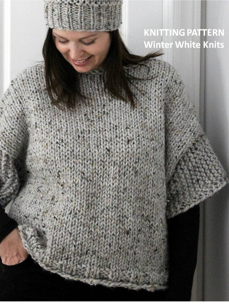 May include: A gray speckled knit sweater with a loose fit and short sleeves. The sweater is shown on a model wearing a gray knit hat. The text "KNITTING PATTERN Winter White Knits" is displayed on the right side of the image.