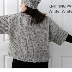 May include: Knitting pattern for a grey and white speckled sweater with a wide, loose fit and short sleeves. The pattern is titled "Winter White Knits".