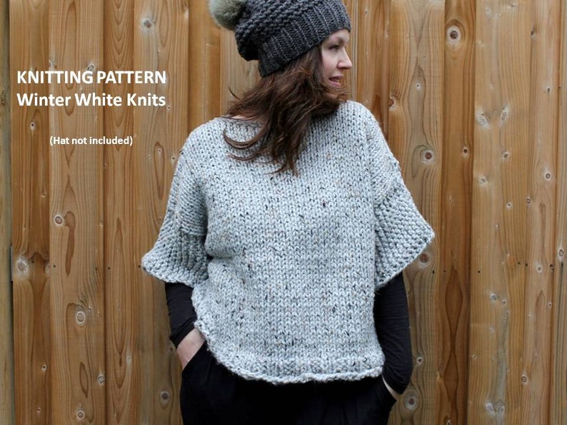 May include: Knitting pattern for a white sweater with a speckled texture. The sweater has a loose fit and a slightly cropped length. The model is wearing a gray beanie.