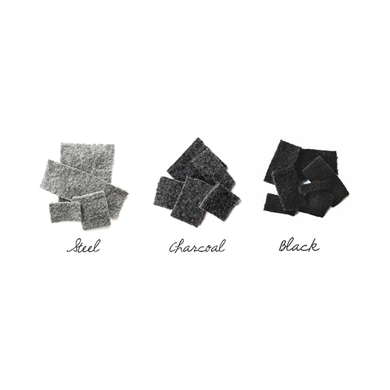 May include: Three swatches of fabric in different shades of gray: steel, charcoal, and black.