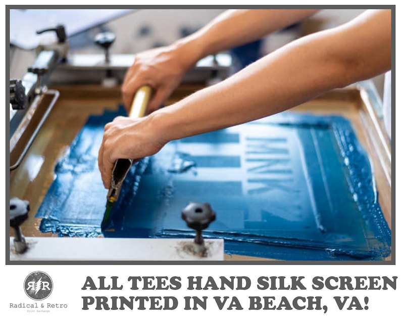 May include: A person using a squeegee to apply blue ink to a screen printing frame. The text "MNK" is visible on the screen. The image also includes the text "ALL TEES HAND SILK SCREEN PRINTED IN VA BEACH, VA!" and the Radical & Retro logo.