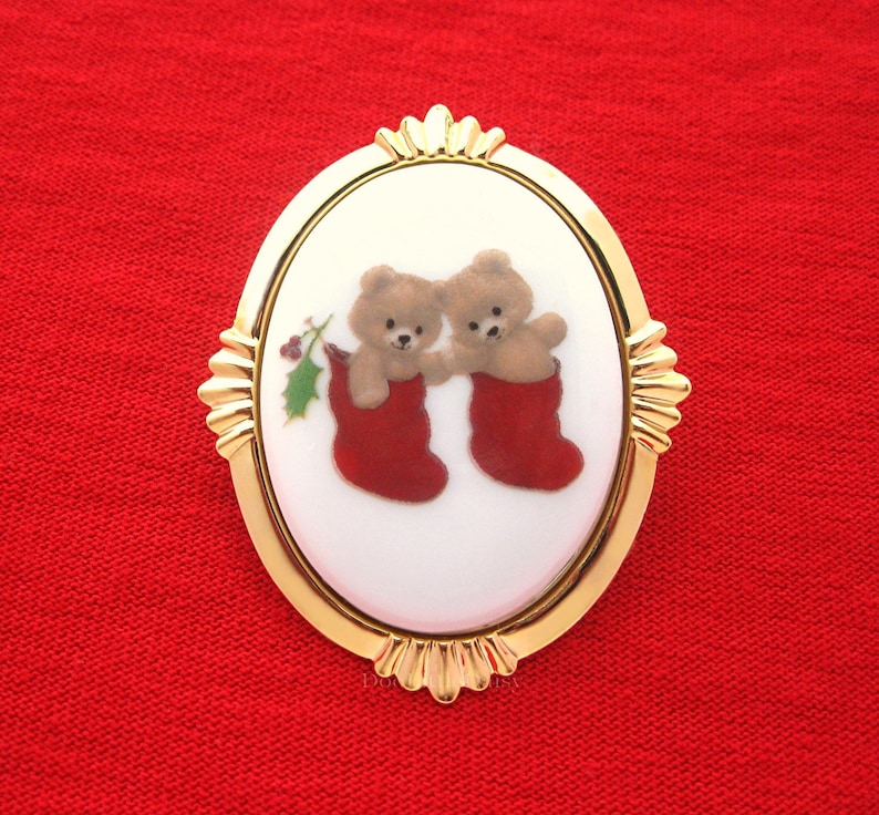 Porcelain Two TEDDY BEARS in Stockings adorned w Holly Costume Jewelry on a Goldtone Starburst Frame Pin Brooch Pendant for Christmas Gift
