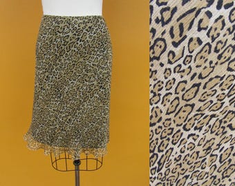 midi en soie à imprimé léopard des années 90 | Jupe taille haute en soie avec bordure en forme de chou | Jupe longueur genou à imprimé animalier | 25 à 28 ans