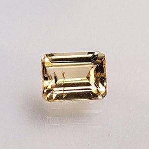 0,53 Ct brazylijski topaz imperialny szlifowany prostokątnie luźny kamień szlachetny