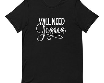 May include: Black t-shirt with white text that reads "Y'all Need Jesus" in a cursive font.
