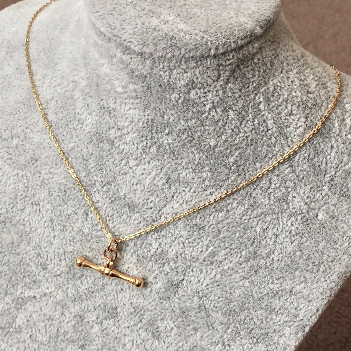 Gold t bone necklace deals