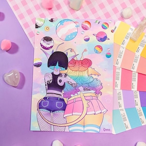 May include: A colorful illustration of two cartoon characters with rainbow hair and tails, standing back to back against a background of rainbow planets and stars. The characters are wearing colorful clothing and have a friendly expression.