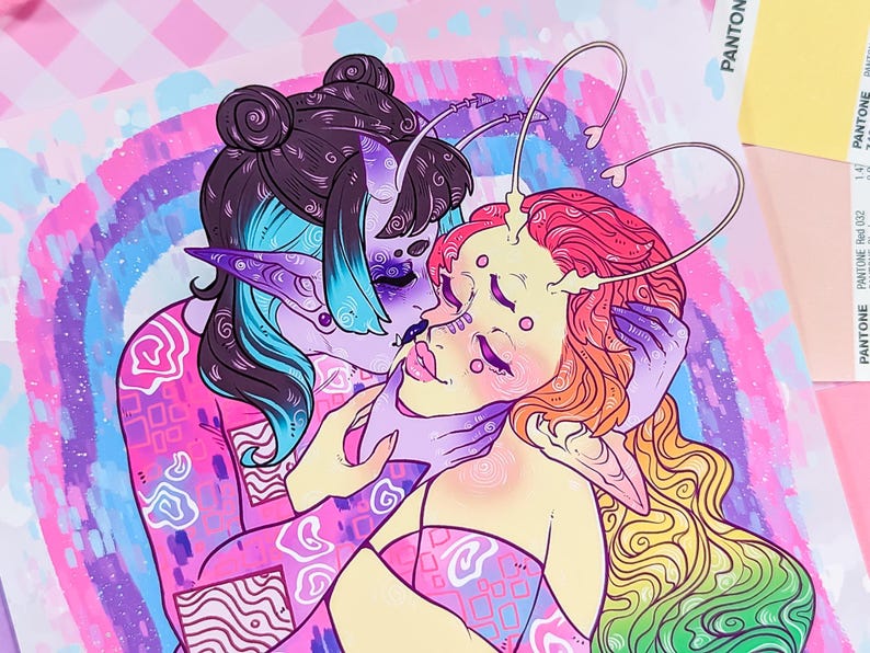 May include: A colorful illustration of two figures embracing. The figure on the left has blue and purple hair, a pink and white patterned shirt, and a pointed ear. The figure on the right has red and yellow hair, a pink and white patterned shirt, and a pointed ear. The background is a rainbow gradient with white clouds.