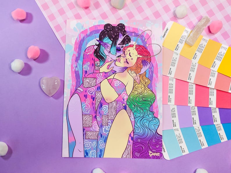 May include: A colorful illustration of two figures embracing. The figure on the left has purple hair and is wearing a pink and blue patterned outfit. The figure on the right has long, rainbow-colored hair and is wearing a pink and blue outfit. The background is a rainbow.