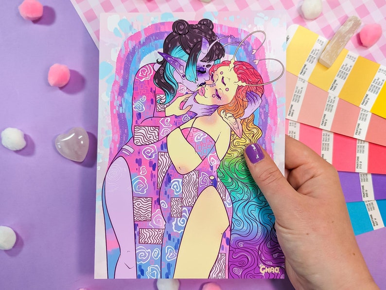 May include: A colorful illustration of two figures embracing. The figure on the left is purple and blue with a crown of hearts. The figure on the right is yellow and pink with a rainbow of hair. The background is a watercolor wash of pink, blue, and purple.