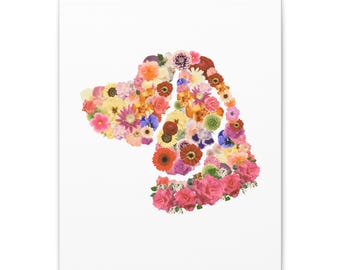 May include: A canvas print featuring a dog silhouette composed of various colorful flowers. The floral arrangement includes pink roses, yellow sunflowers, and other blooms, set against a white background. The artwork is a decorative piece.