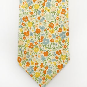 A handmade floral necktie with a small ditsy flower print.