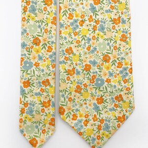 A handmade floral necktie with a small ditsy flower print.